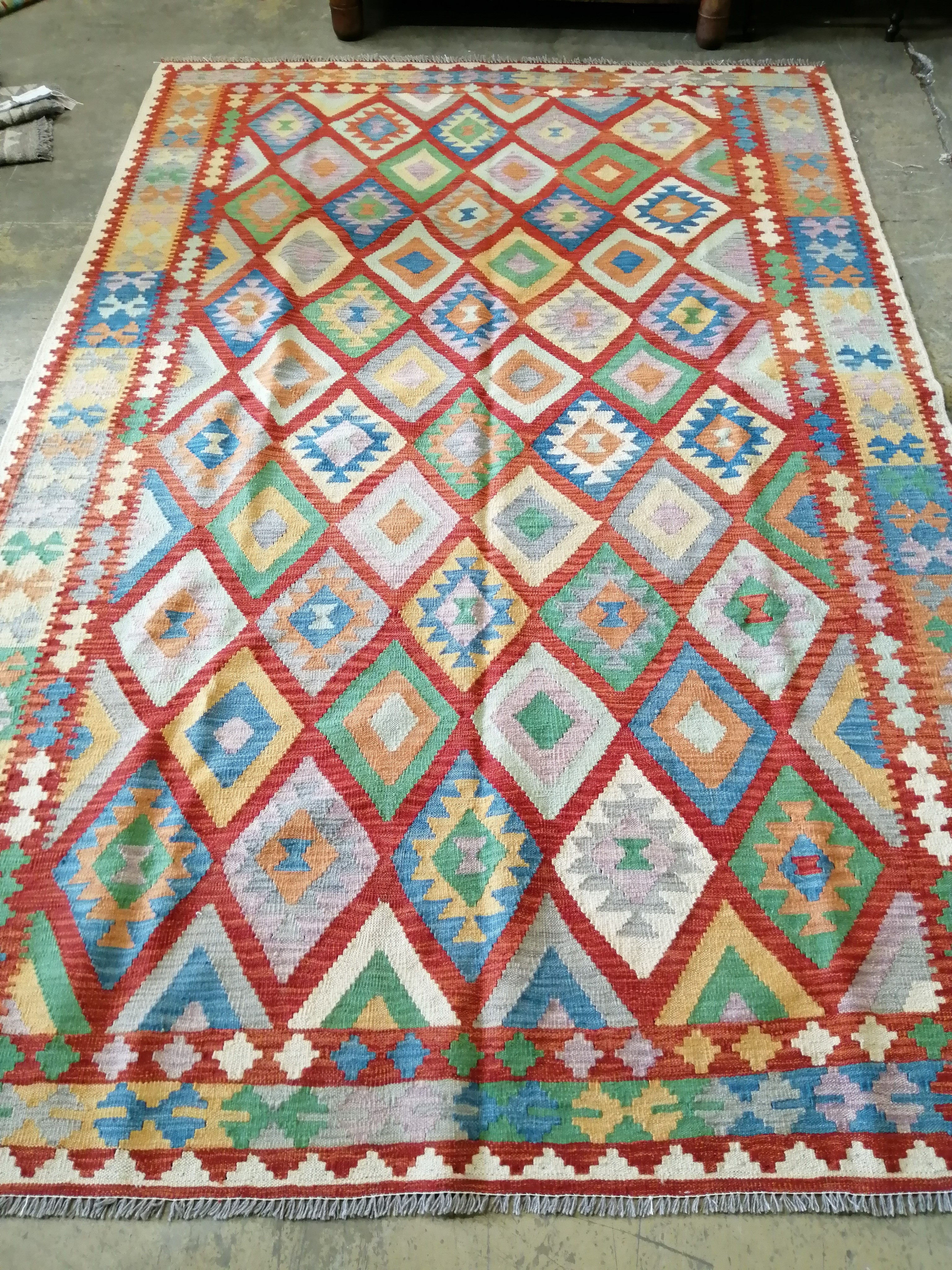 A large Anatolian style polychrome Kilim flatweave carpet, 295 x 195cm